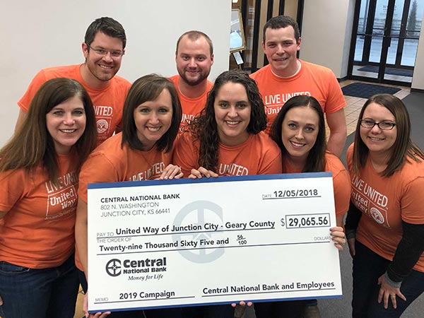 image of employees presenting check to the United Way committee