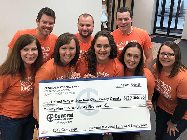 bank employees presenting large check to the United Way committee